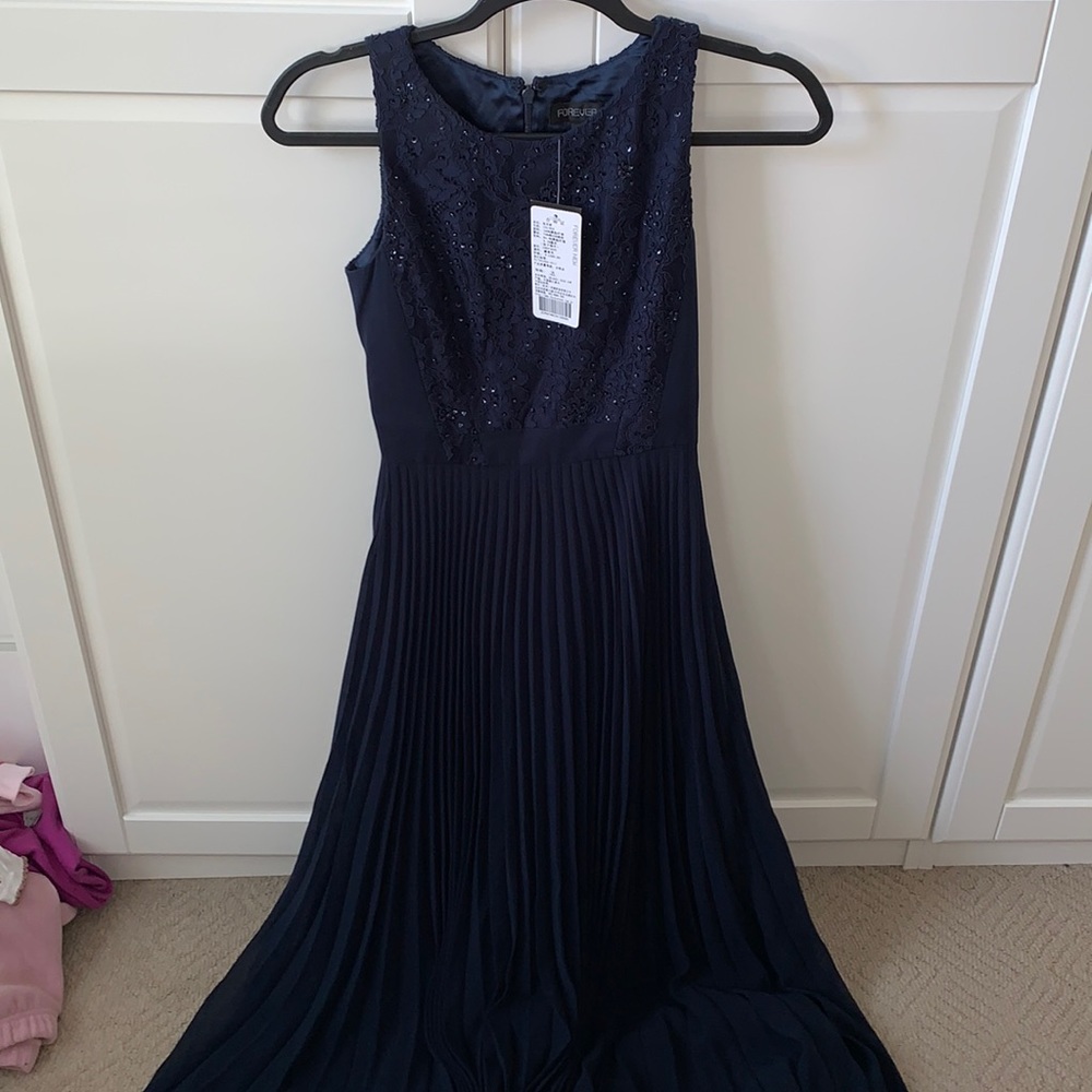 Navy blue prom dress with pleated skirt